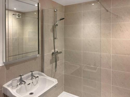 a bathroom with a shower and a sink at Chapel Barn - Uk46738 in Shapwick