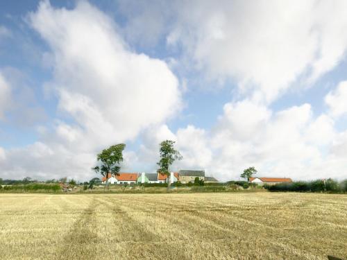 a field of dry grass with houses in the background at Speed The Plough- Uk43631 in Grange