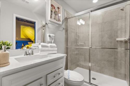a bathroom with a shower and a toilet and a sink at Ev16147 - Coastal Manor in Clermont