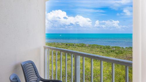 a balcony with a view of the ocean at Coastal Joy 3412 Ocean Pointe in Tavernier