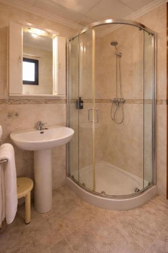 a bathroom with a shower and a sink at Hotel Lago Dorado in La Savina