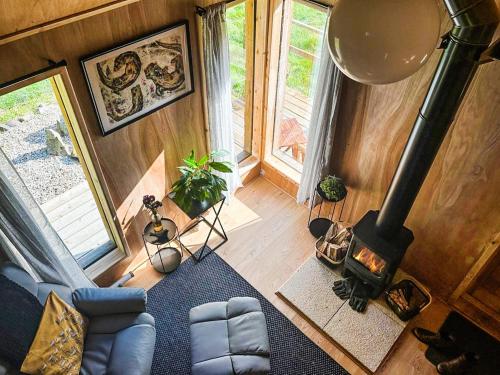 an aerial view of a living room with a fireplace at Otter Gulley in Eddleston