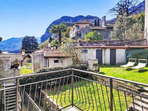a view of a village with mountains in the background at Apartment Lakeview Menaggio by Interhome in Menaggio