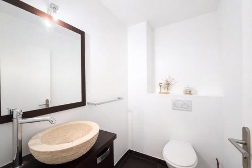a bathroom with a sink and a toilet at M031 Joli t3 centre d'Annemasse in Annemasse