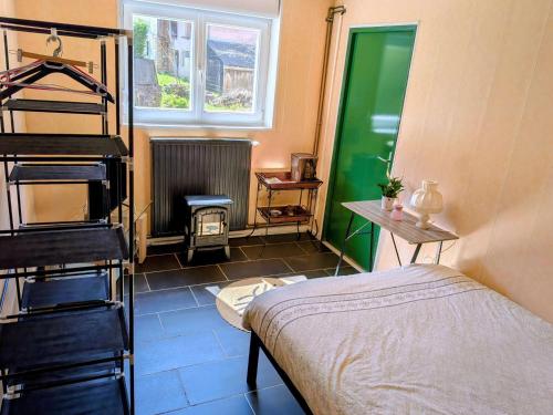 Llit o llits en una habitació de Le Petit Moulin