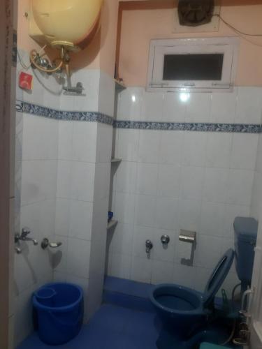 a bathroom with a toilet and a sink at Ghar Family-Homestay- 2 Room -Prime Location - Balcony kitchen-Don't book Single Room Book a complete Home in Solan