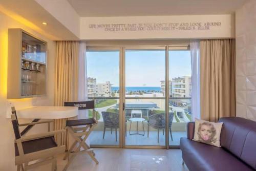 a living room with a view of the ocean at Planet Hollywood Cancun Adult Scene by Royalton, An Autograph Collection All-Inclusive Resort - Adults Only in Cancún