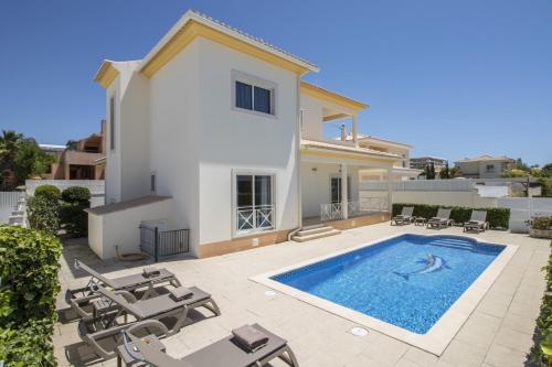 an image of a villa with a swimming pool at Villa Maresia by Algarve Holidays in Galé
