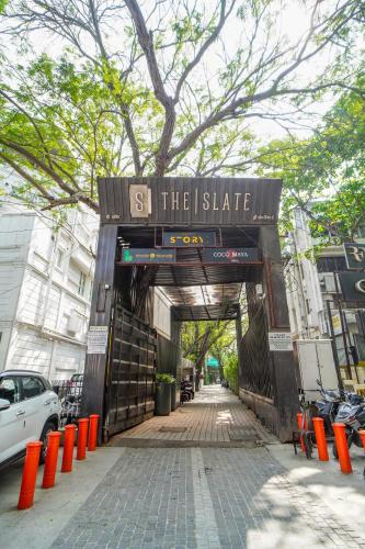 a sign that says s the i state on a street at Open Hotel by Olive - Slate in Chennai