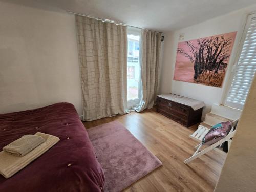 a bedroom with a bed and a window at Villa Rosa Boutique in Almancil