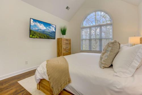 a bedroom with a large bed and a window at Lake Vista Lodge in Jasper