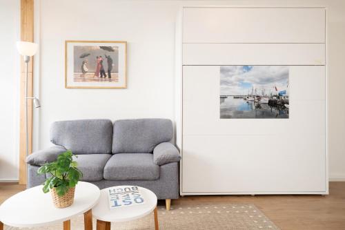 a living room with a couch and a table at Marina Wendtorf Oase in Wendtorf