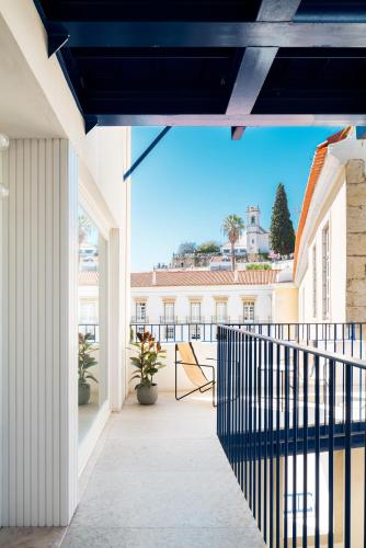 a balcony with a view of a building at A Escada - Alfama Design Apartments in Lisbon
