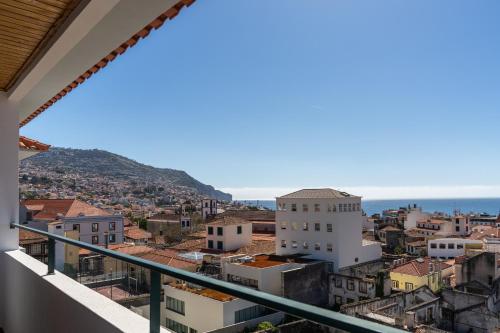 a view of a city from a balcony at Casa Sta Clara by An Island Apart in Funchal