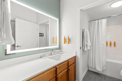 a bathroom with a sink and a mirror at Sonesta ES Suites Phoenix Goodyear in Goodyear
