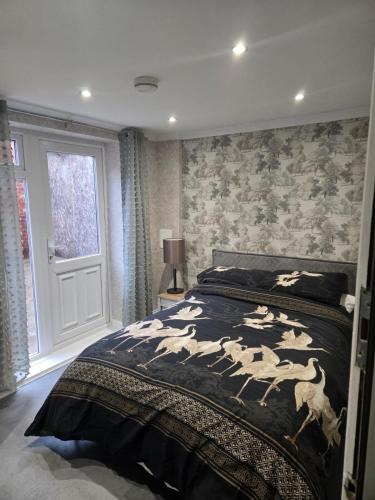 a bedroom with a bed with a horse blanket at Levy Nook 6 in Darlington