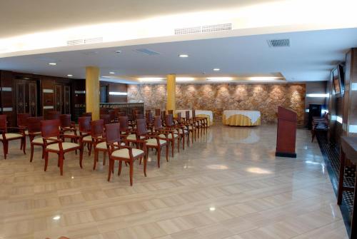a room with a bunch of chairs and a table at Hotel & Spa Sierra de Cazorla 4* in Cazorla