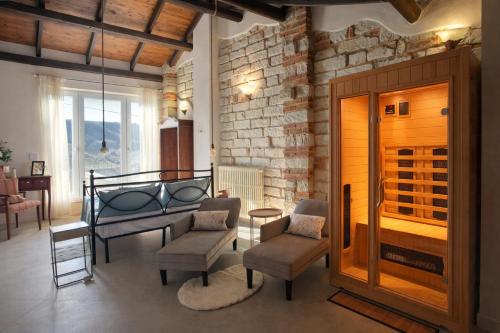 a room with chairs and a table and a room with a window at Holiday Home Camino Monferrato in Camino