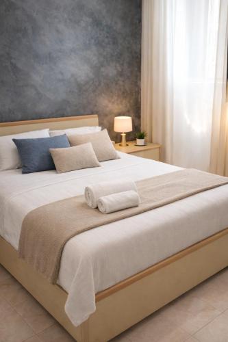a bedroom with a large bed with two towels on it at A Mare in Vasto