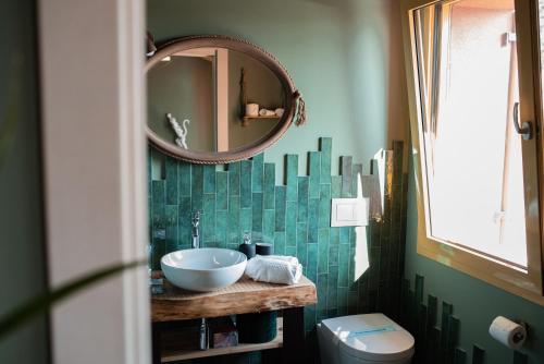 a bathroom with a sink and a mirror at Bed & Breakfast Gioia di... in Santo Stino di Livenza