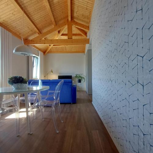 a living room with a table and a blue couch at RestOnDouro Oporto Family in Valbom