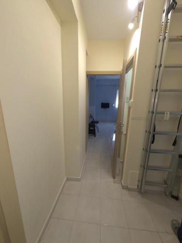 a hallway with a staircase in a room at Volakis apartments in Chios