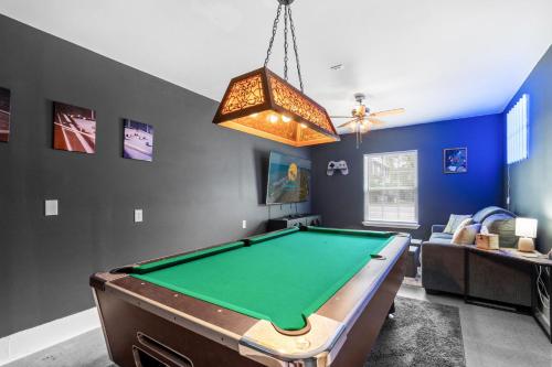 a living room with a pool table in it at Whispering Marsh Hideaway - Peaceful House in Myrtle Beach