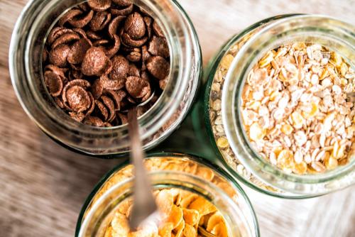 three bowls of food with nuts in them at Hotel Victoria in Lublin