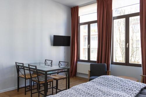 Ліжко або ліжка в номері tam tam city lodge