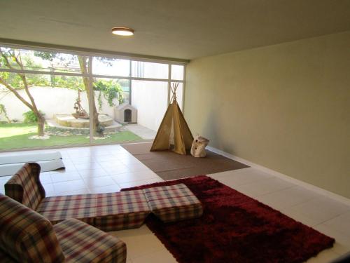 a living room with a couch and a tent at Casa da Âncora in Viana do Castelo