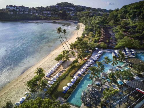 an aerial view of a resort with a beach at Pullman Phuket Panwa Beach Resort in Panwa Beach