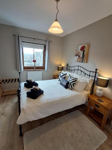 a bedroom with a large bed and a window at The Brooks in Newcastle