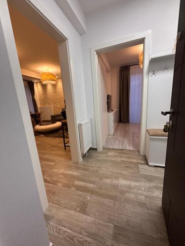 a corridor of a hotel room with a hallway at The View Apartment Bușteni in Buşteni
