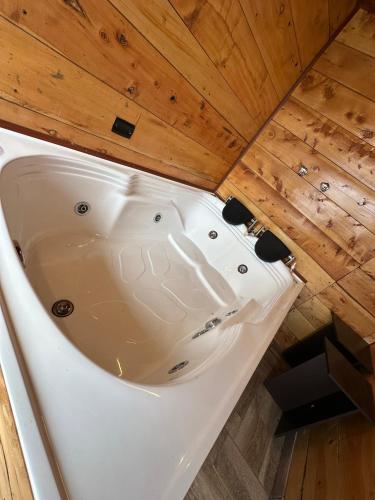 an overhead view of a bath tub in a wooden ceiling at Chalet - Laguna de la Cocha in Pasto