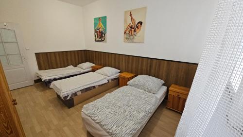 a room with two beds in a room at Hradna 9a in Nové Zámky