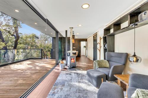 an open living room with a view of a house at Zaire Lodge in Mira