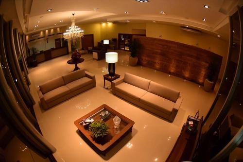 Uma área de estar em Caleche Park Hotel