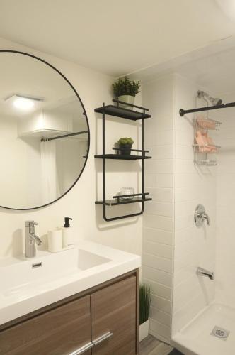 a bathroom with a sink and a mirror at ION House - Near Shopping Kennedy Station Easy Transit Downtown in Toronto