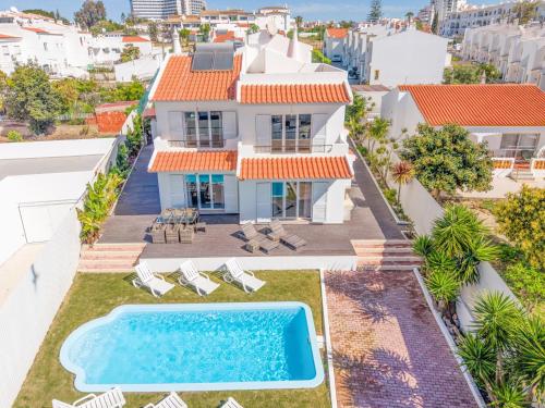 an aerial view of a house with a swimming pool at Large Villa - Private Pool - 6 Bedrooms in Albufeira