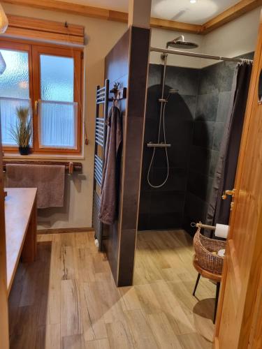 a bathroom with a shower and a sink at Ferienwohnung Ehring in Kiefersfelden