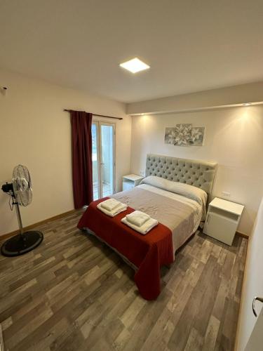 a bedroom with a bed and a fan in it at Terrazas del Gracian in La Puerta