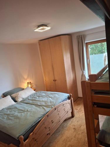a bedroom with a bed and a window at Ferienwohnung Theresia in Laufen