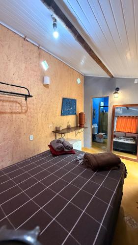 a bedroom with a large bed in a room at Chalé Orion in Lençóis