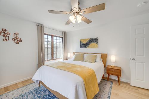 a bedroom with a bed and a ceiling fan at Midtown Tulsa Gem w/ MCM Decor: Private Deck, Yard in Tulsa