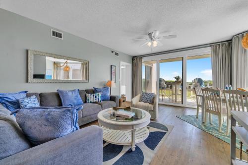 a living room with a couch and a table at Tranquillity 140 - A Wave From It All in Inlet Beach