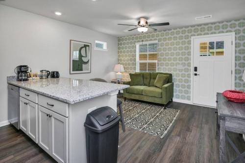 a kitchen with a counter and a chair in a room at Hampton Cottage - DT COLA in Columbia
