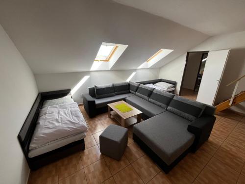a living room with a couch and a table at Penzión Dvorec in Dvorec