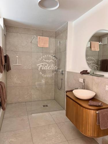 a bathroom with a shower and a sink at Apartment Fidelia in Vandans