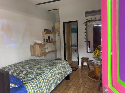 a bedroom with a bed and a table and a mirror at Vista primavera in Salento