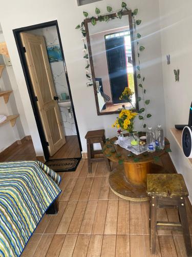 a living room with a table and a mirror at Vista primavera in Salento